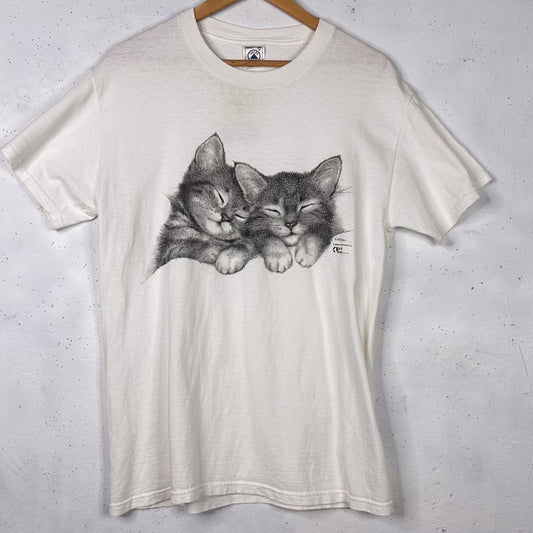 90's Kitten White Delta Tee By V. Miller | Earth Tones (M)